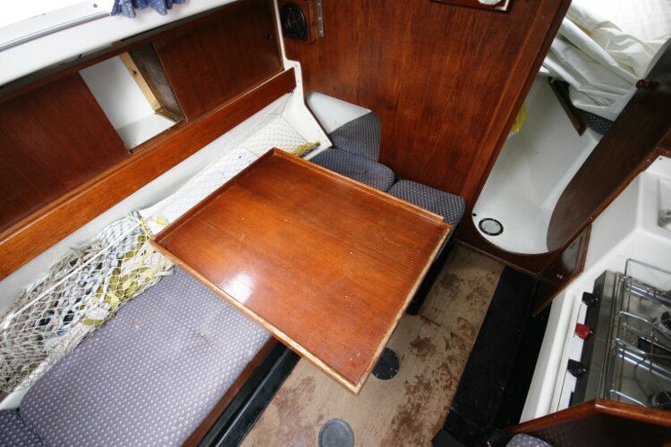Master Marine Eygthene 24for sale The port settee berth - The saloon table swings away