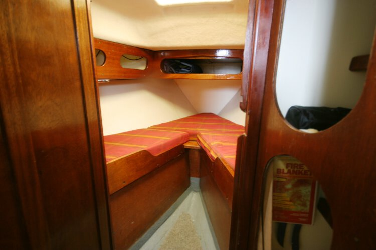 Morgan Giles for sale The fore cabin - With two berths, the heads compartment is located to port and the hanging locker to starboard