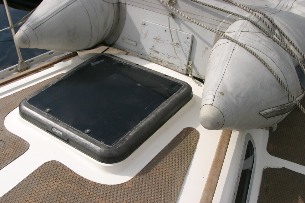 Trident Voyager 35for sale Forehatch - The owner stores the dinghy upside down on the foredeck when unattended to prevent it filling with water on he davits.