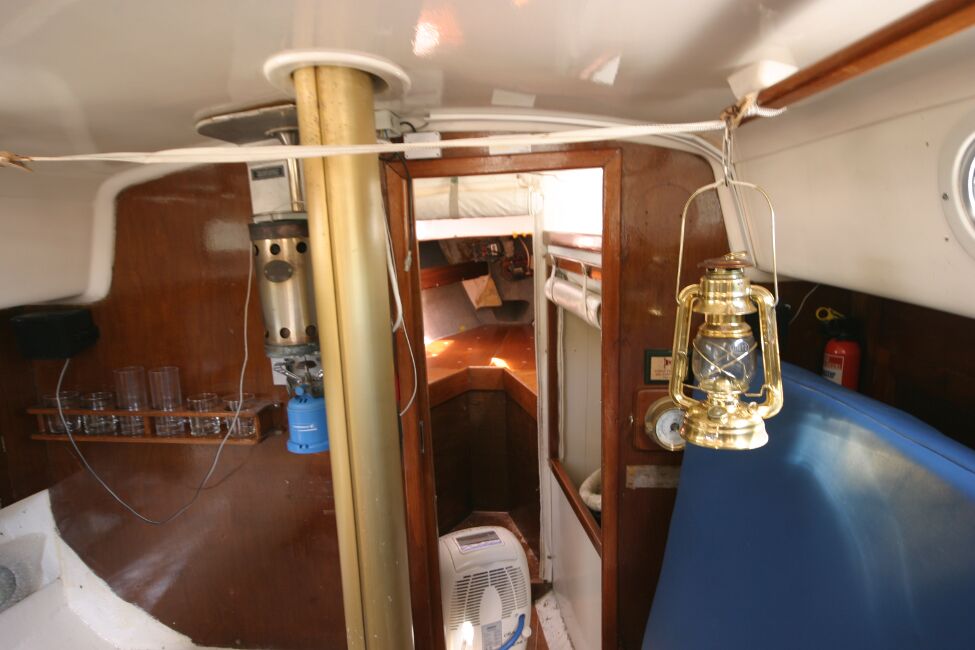 Contessa 32for sale Saloon looking towards forward cabin  - Small gas cabin heater mounted on bukhead with external flue.